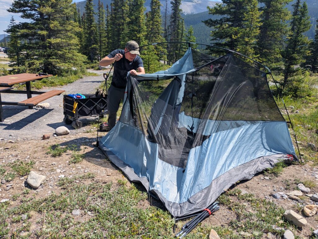 building the tent at the campsite
